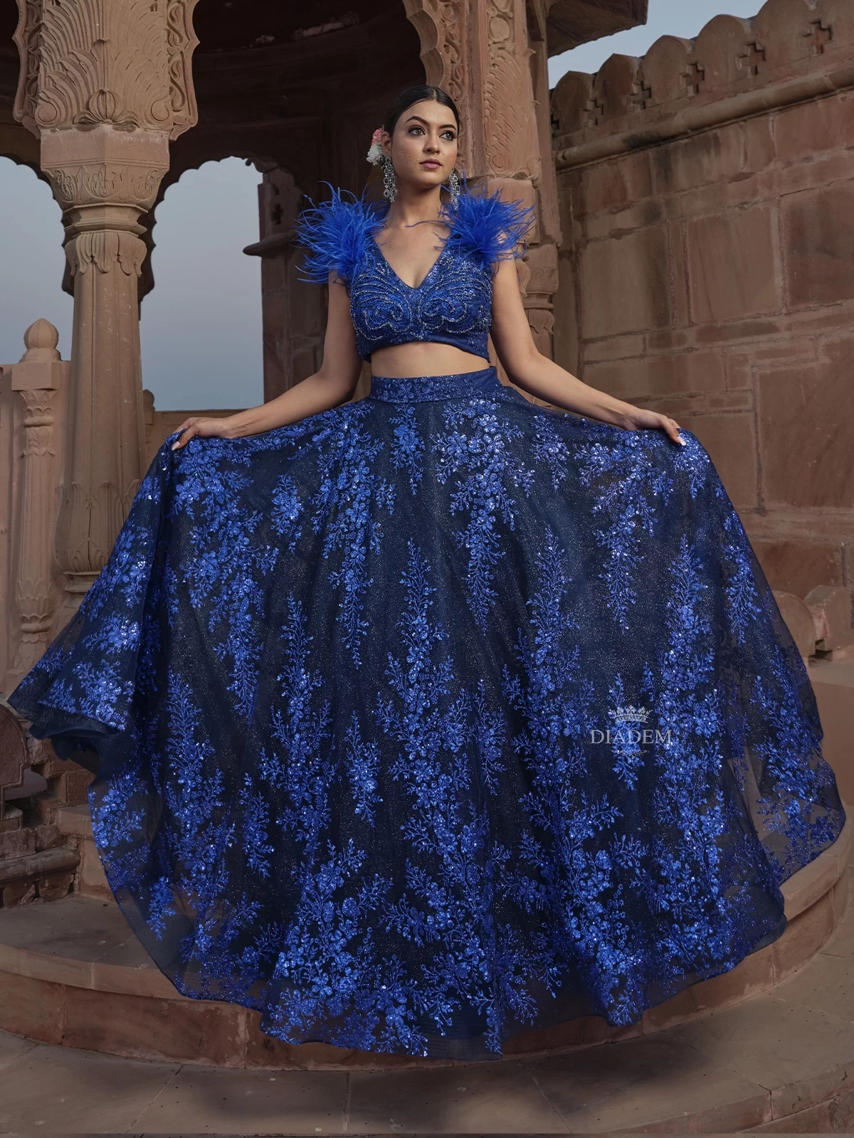 Royal Blue Net Lehenga With Floral Sequin Embellishments And Sleeveless With Feathers