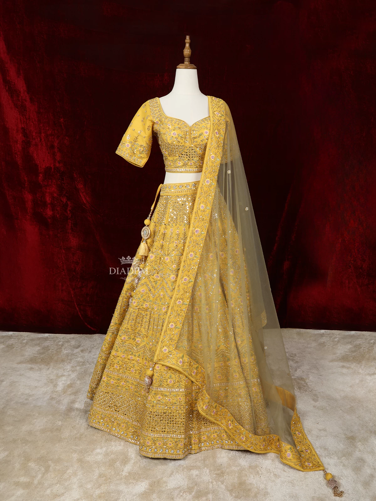 Yellow Silk Lehenga with Floral Embroidery and Mirror Work, Paired with Net Dupatta