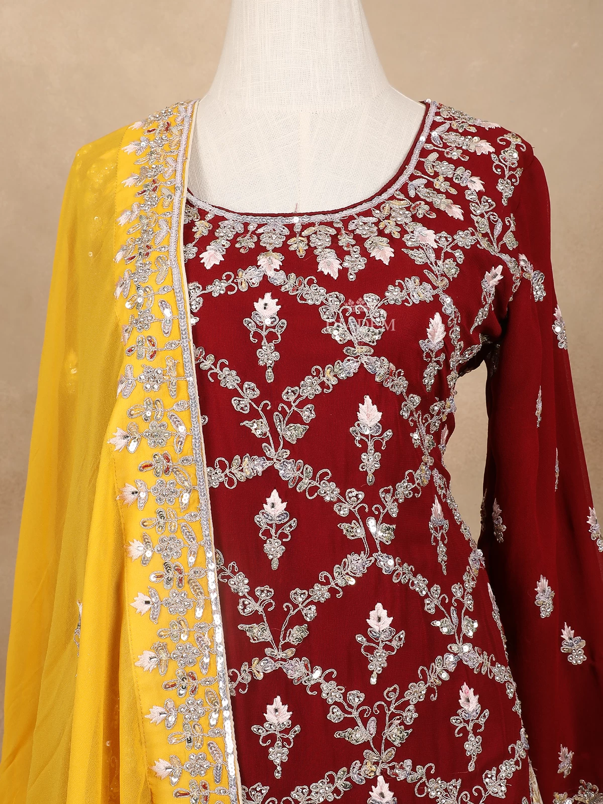 Dark Red With Yellow Net Lehenga Embellished With Floral Embroidery Paired With Dupatta