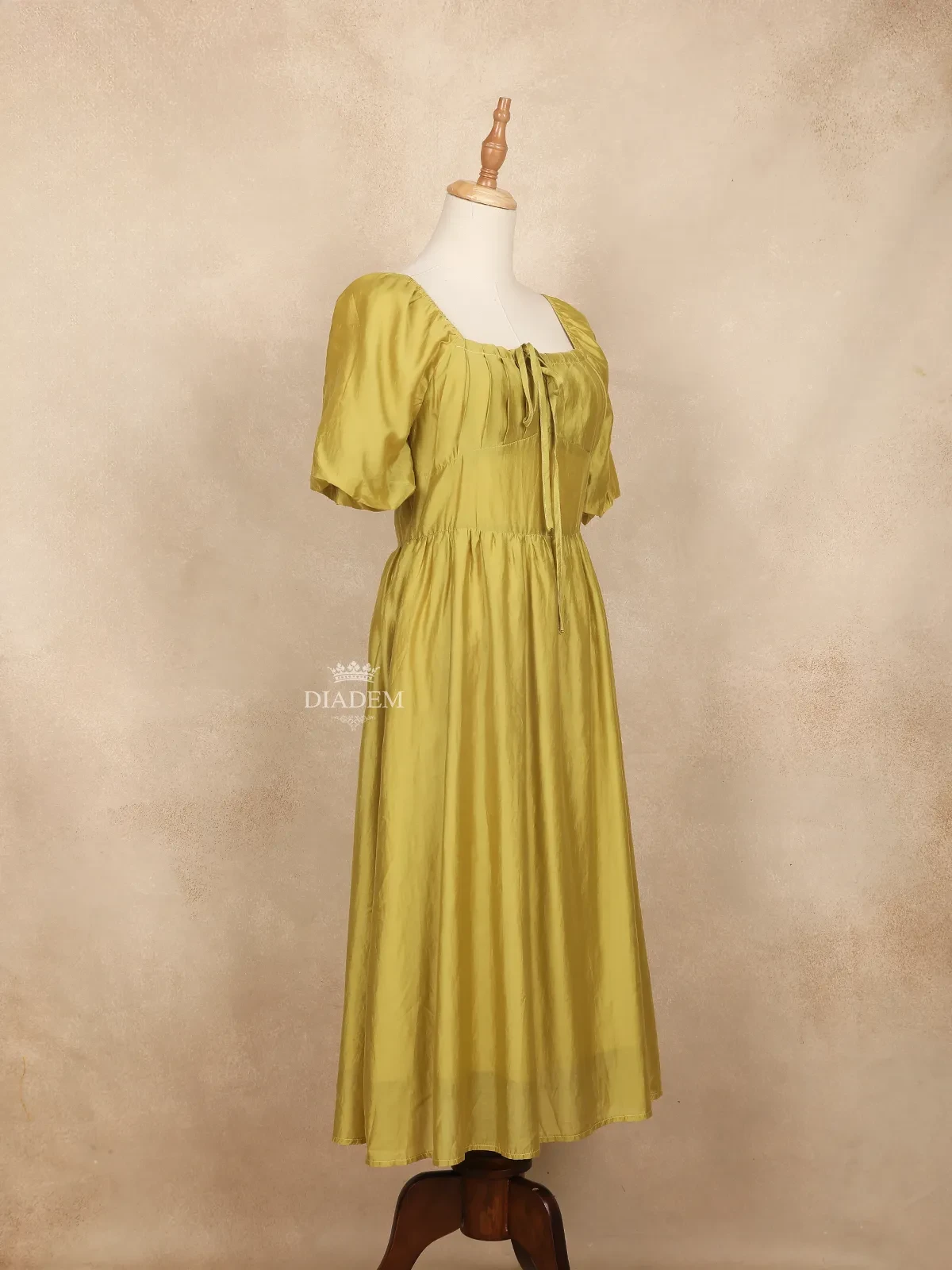 Olive Yellow Gown Adorned With Pleated And Plain Design And Without Dupatta