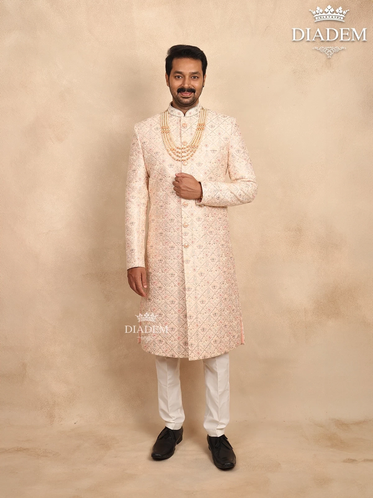 Cream Raw Silk Sherwani Suit With Floral Threadwork Embroidery, Paired With Bead Mala