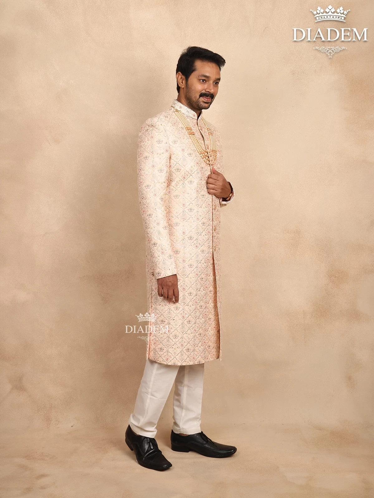 Cream Raw Silk Sherwani Suit With Floral Threadwork Embroidery, Paired With Bead Mala