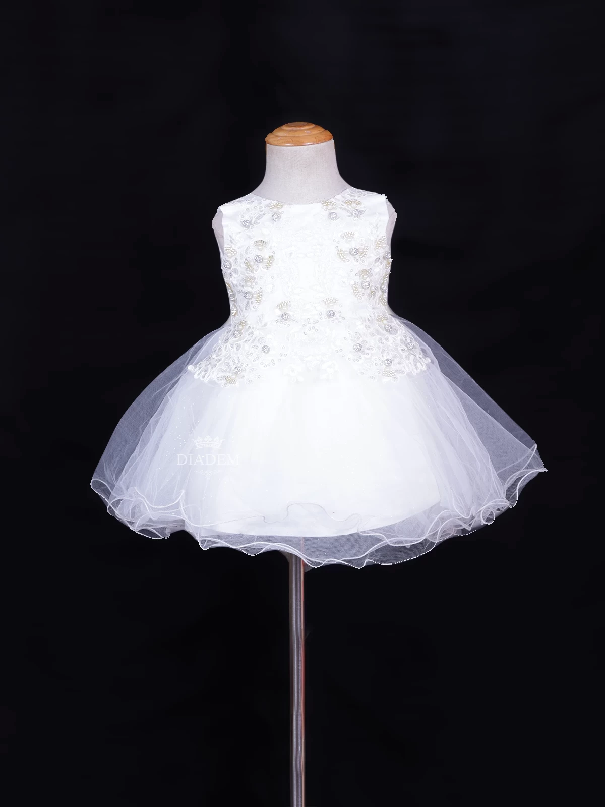 White Net Frock Adorned With Floral Laces And Pearl Beads