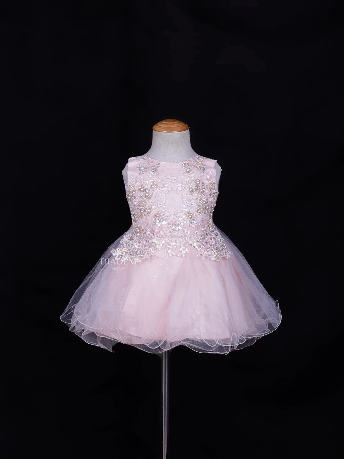Light Peach Net Frock Embellished With Floral Laces And Pearl Beads