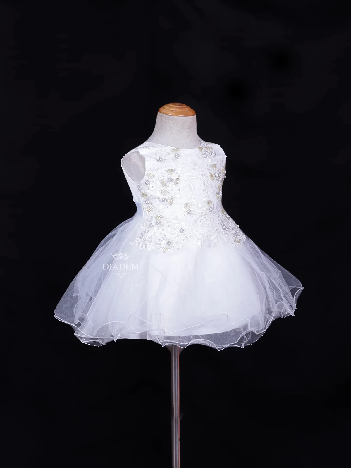 White Net Frock Adorned With Floral Laces And Pearl Beads