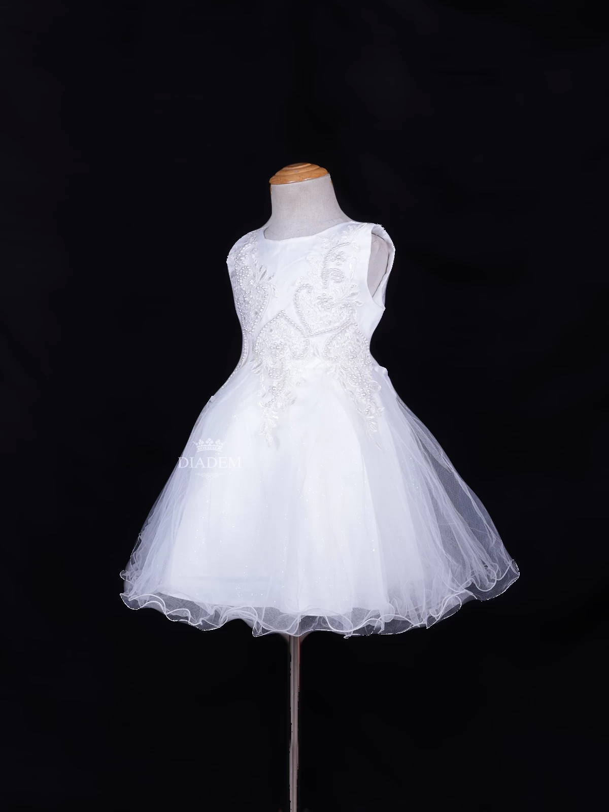White Net Frock Embellished With Floral Laces And Pearl Beads