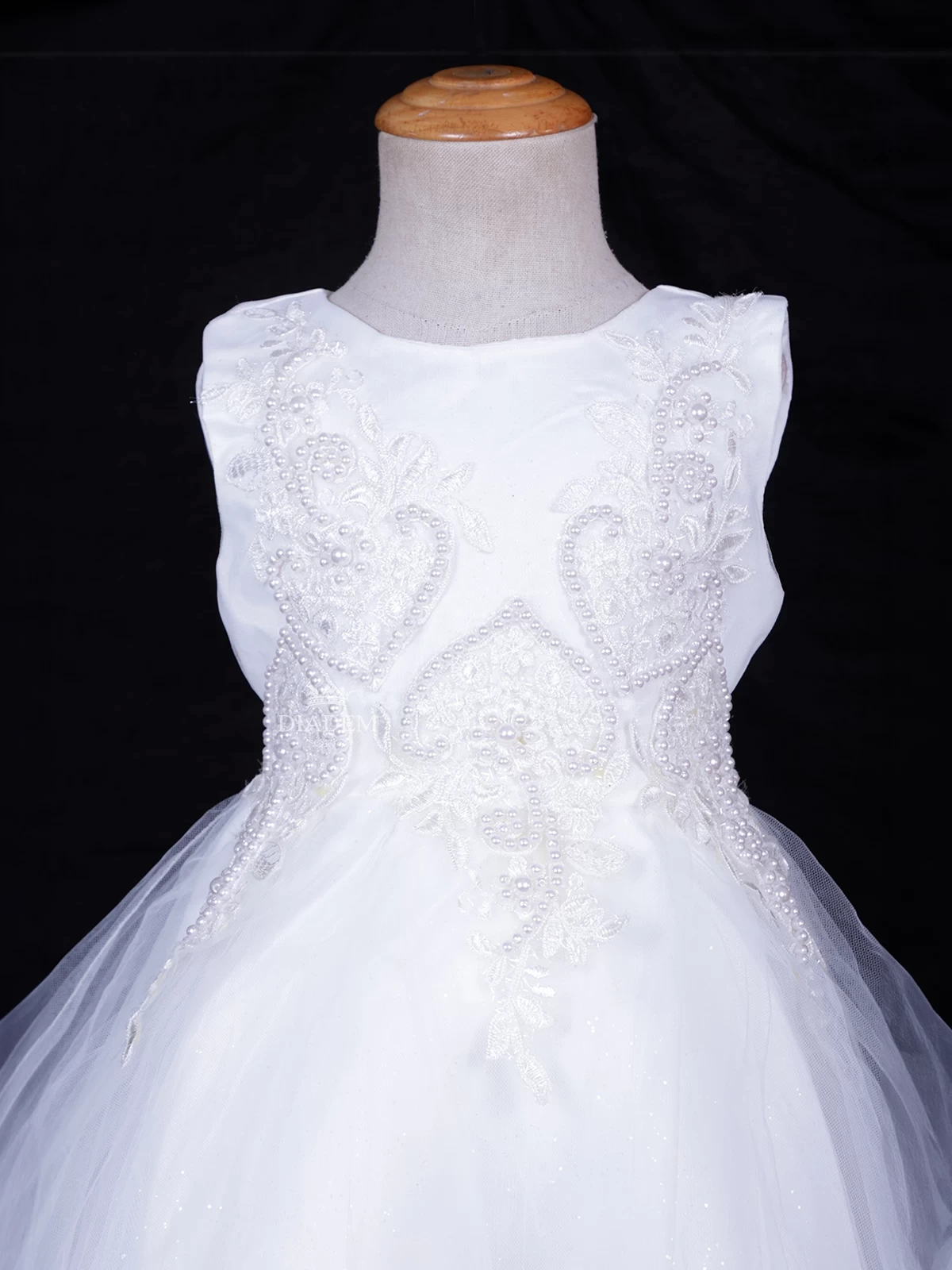 White Net Frock Embellished With Floral Laces And Pearl Beads