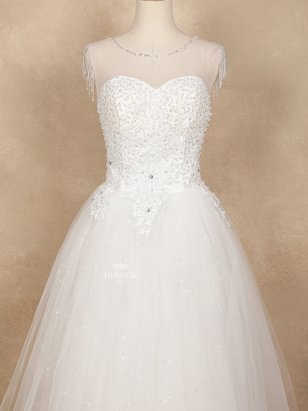 White Wedding Net Gown Adorned With Sequins And Bead Work With Beaded Tassels On Sleeve