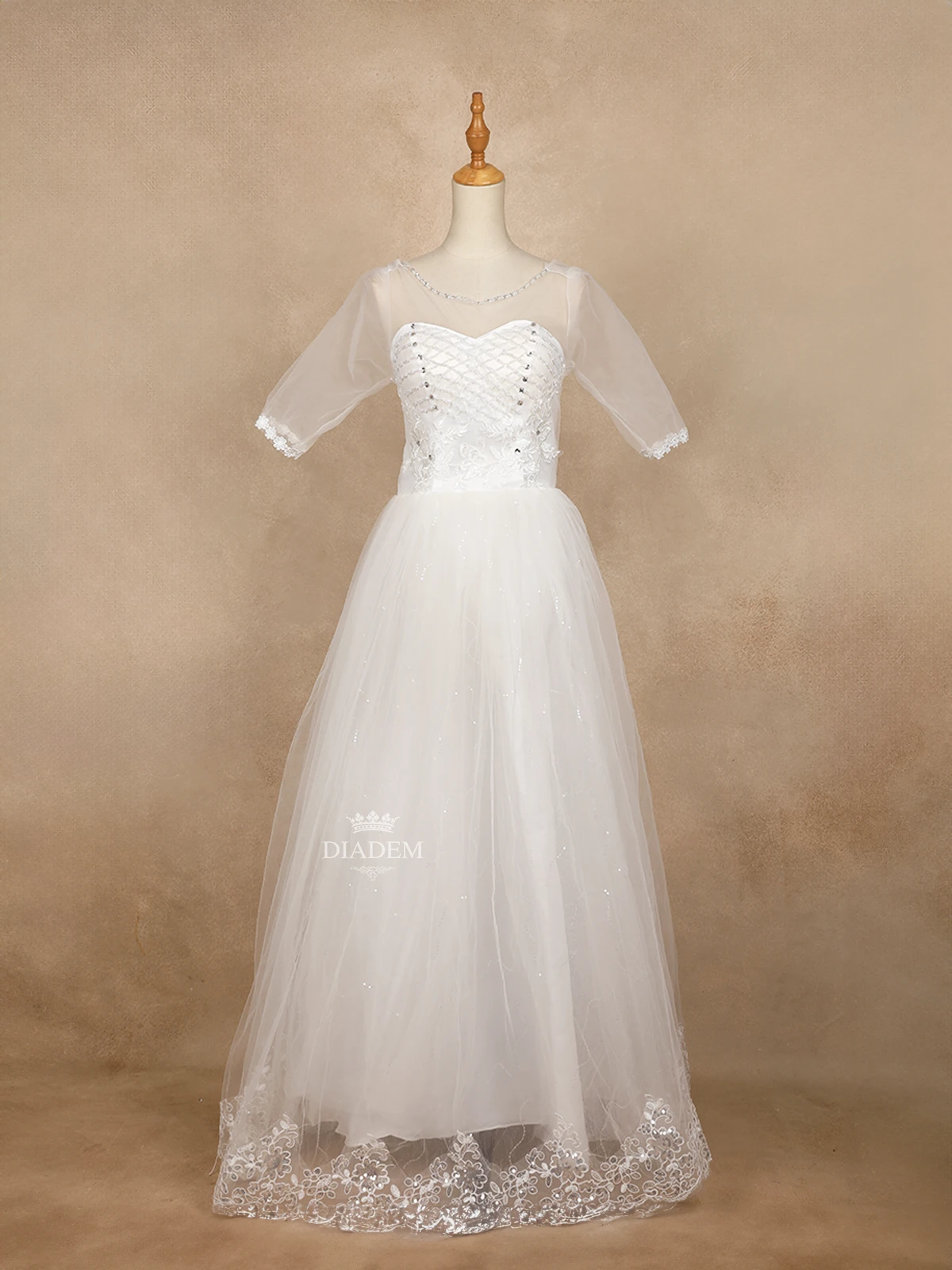 White Wedding Gown Adorned with Floral Design and Criss Cross Beads and Stones