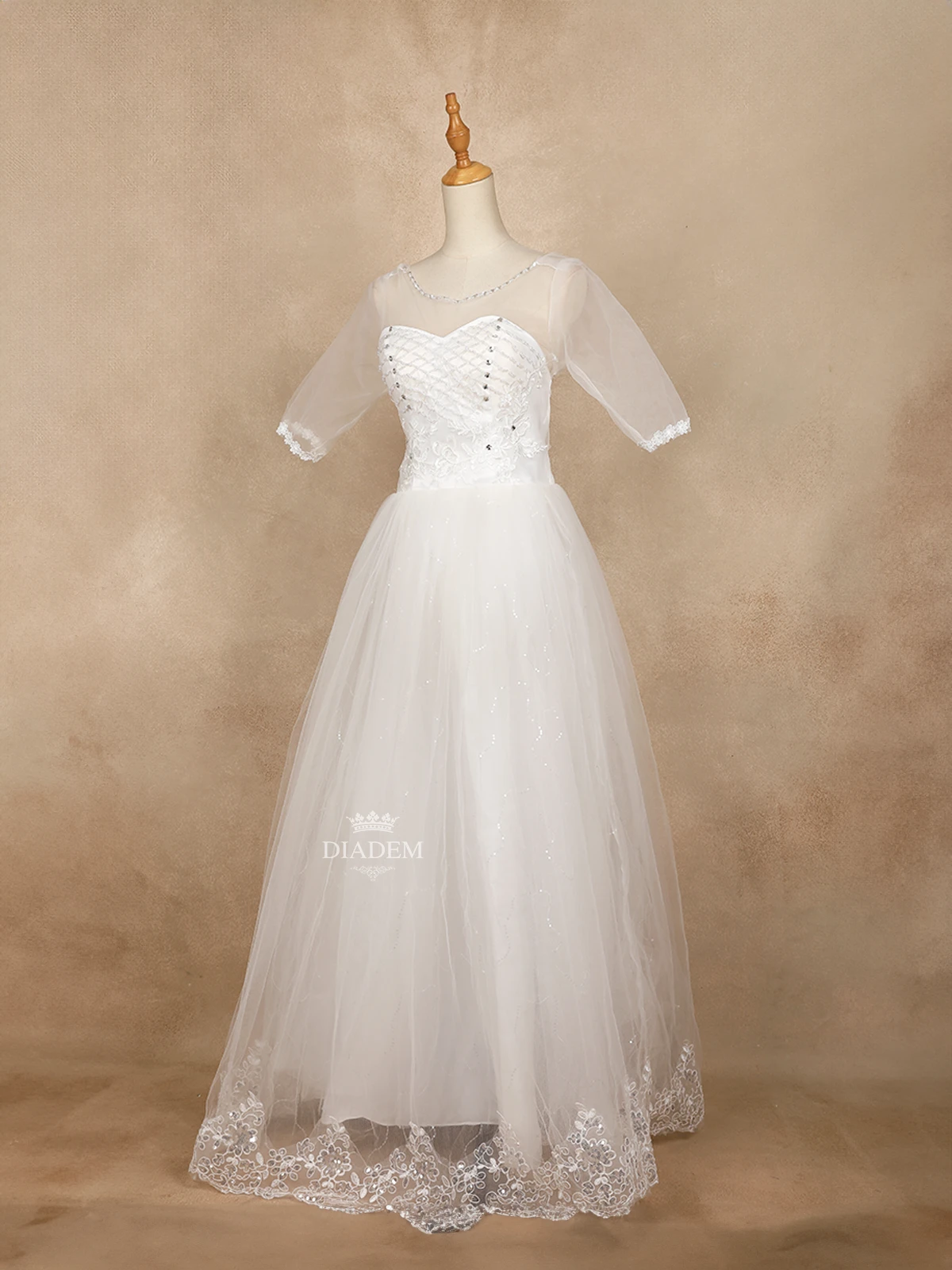 White Wedding Ball Gown Adorned In Floral Design And Laces And Stones