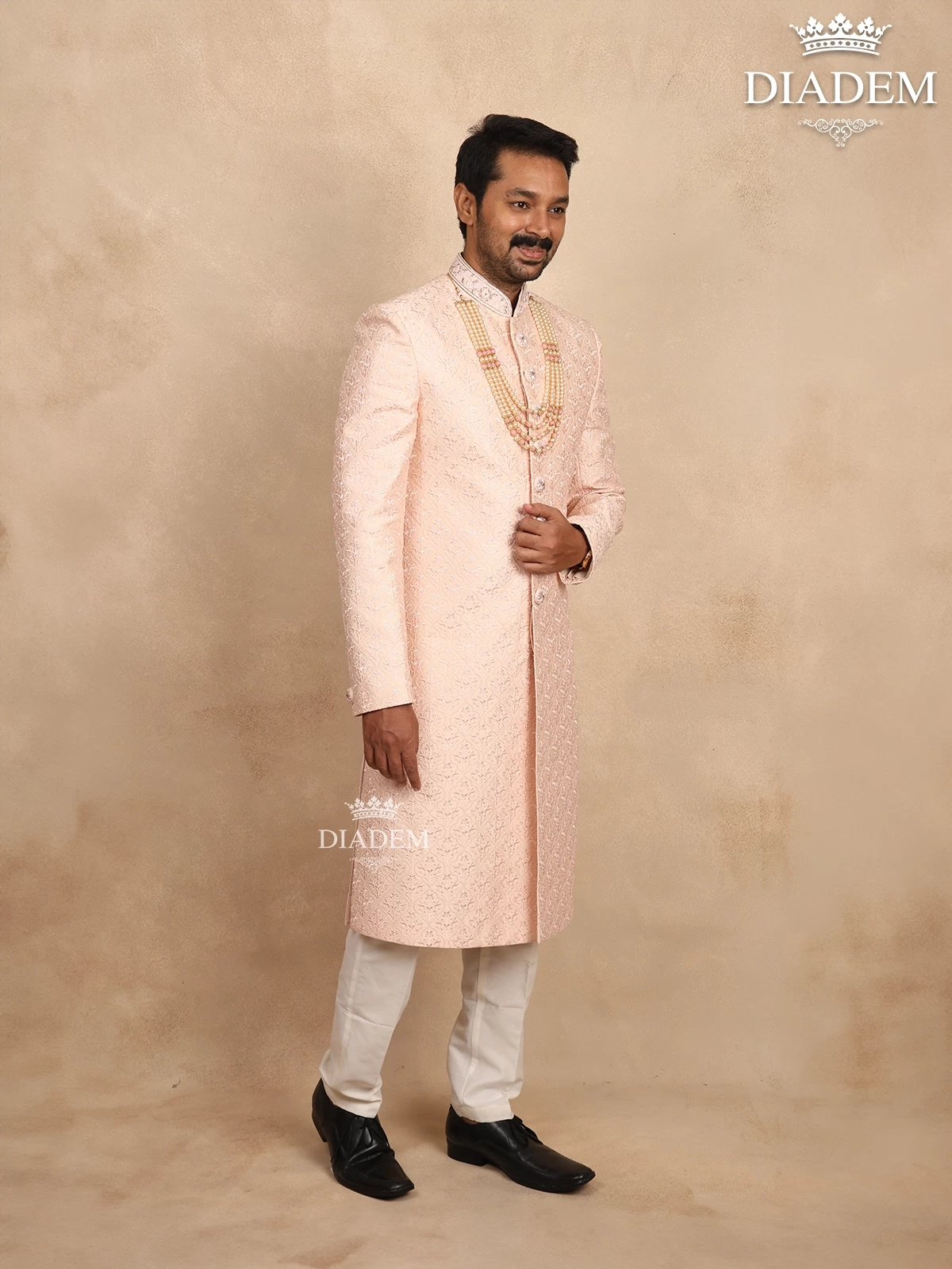 Light Peach Raw Silk Sherwani Suit Adorned With Floral Threadwork Embroidery, Paired With Bead Mala