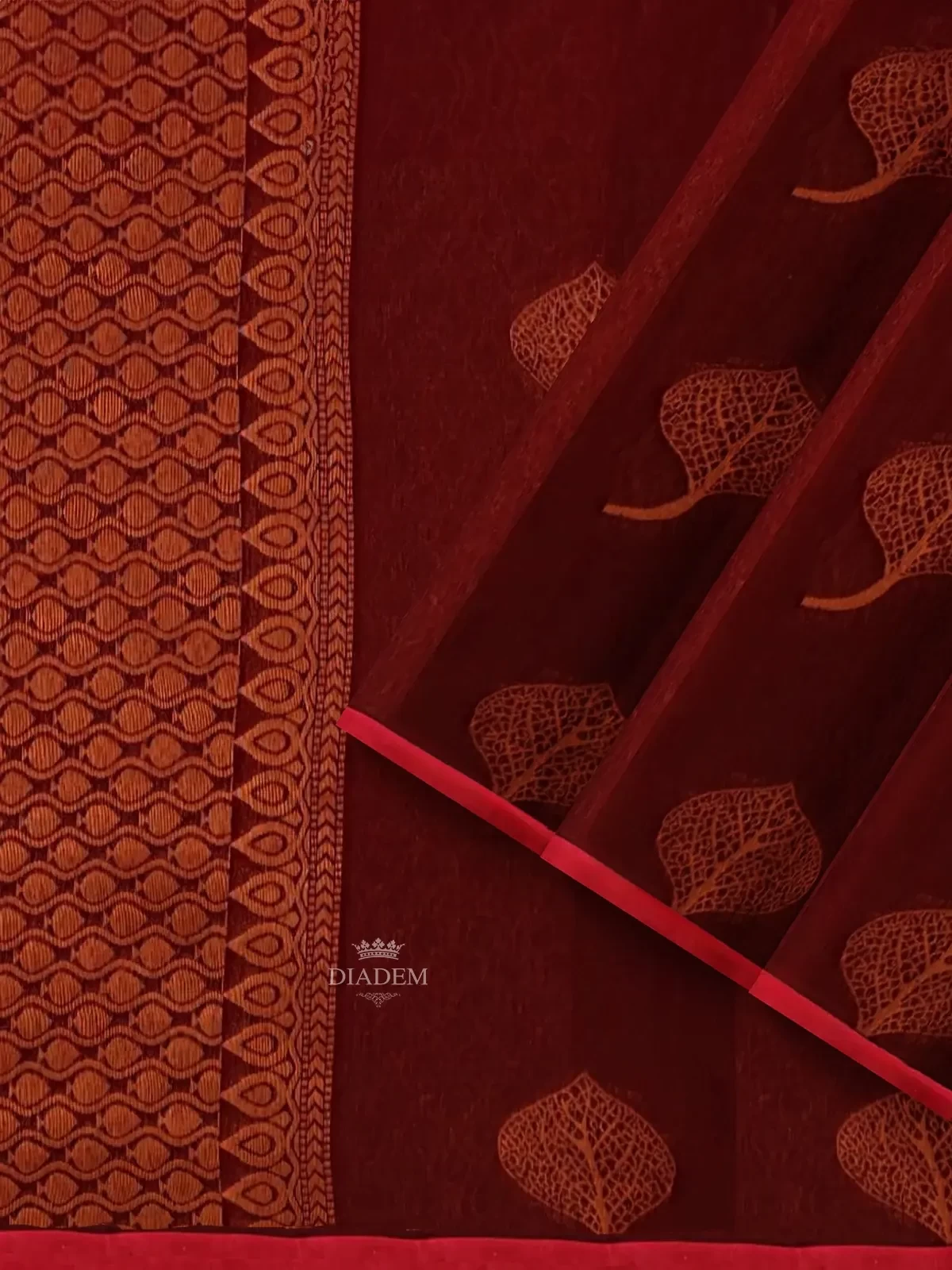 Maroon Silk Cotton Saree With Design Prints On The Body And Without Border