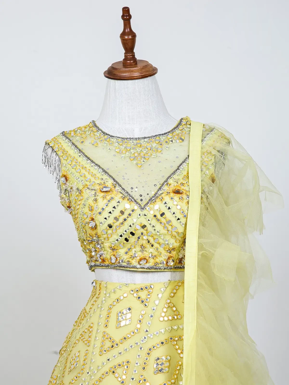 Light Yellow Net Lehenga Embellished With Foil And Thread Work Along With Ruffle Dupatta